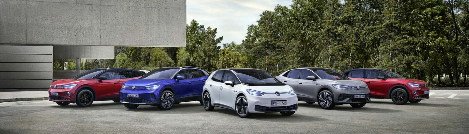 different small cars in front of trees