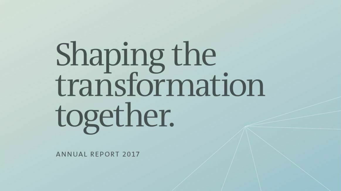 Graphic design featuring the text "Shaping the transformation together." with the addition "Annual Report 2017", styled in shades of blue with abstract lines.